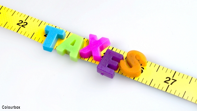 The letters "TAXES" layed out on a measuring band; illustration photo: colourbox.no