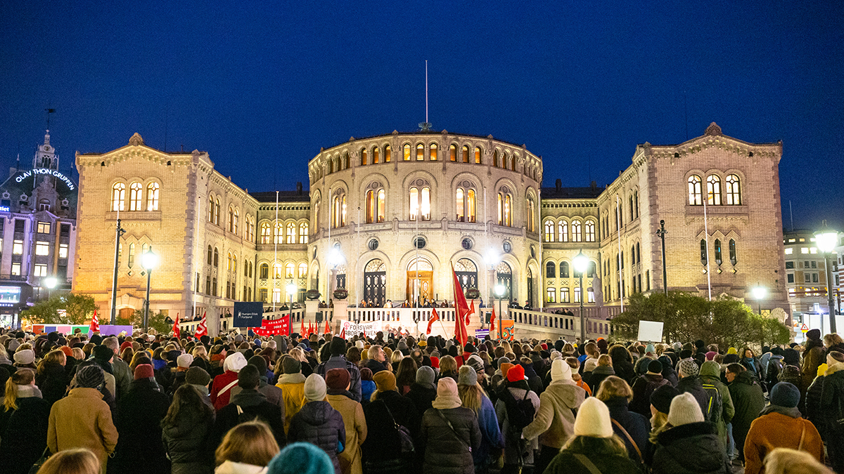 People protest in front of the Norwegian parliament. 