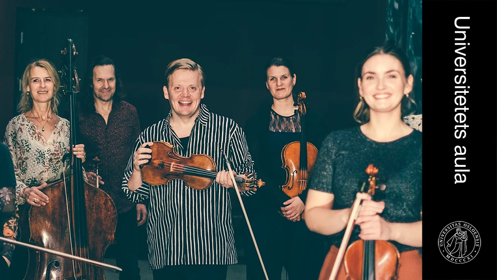 Five people smiling at the camera while holding instruments